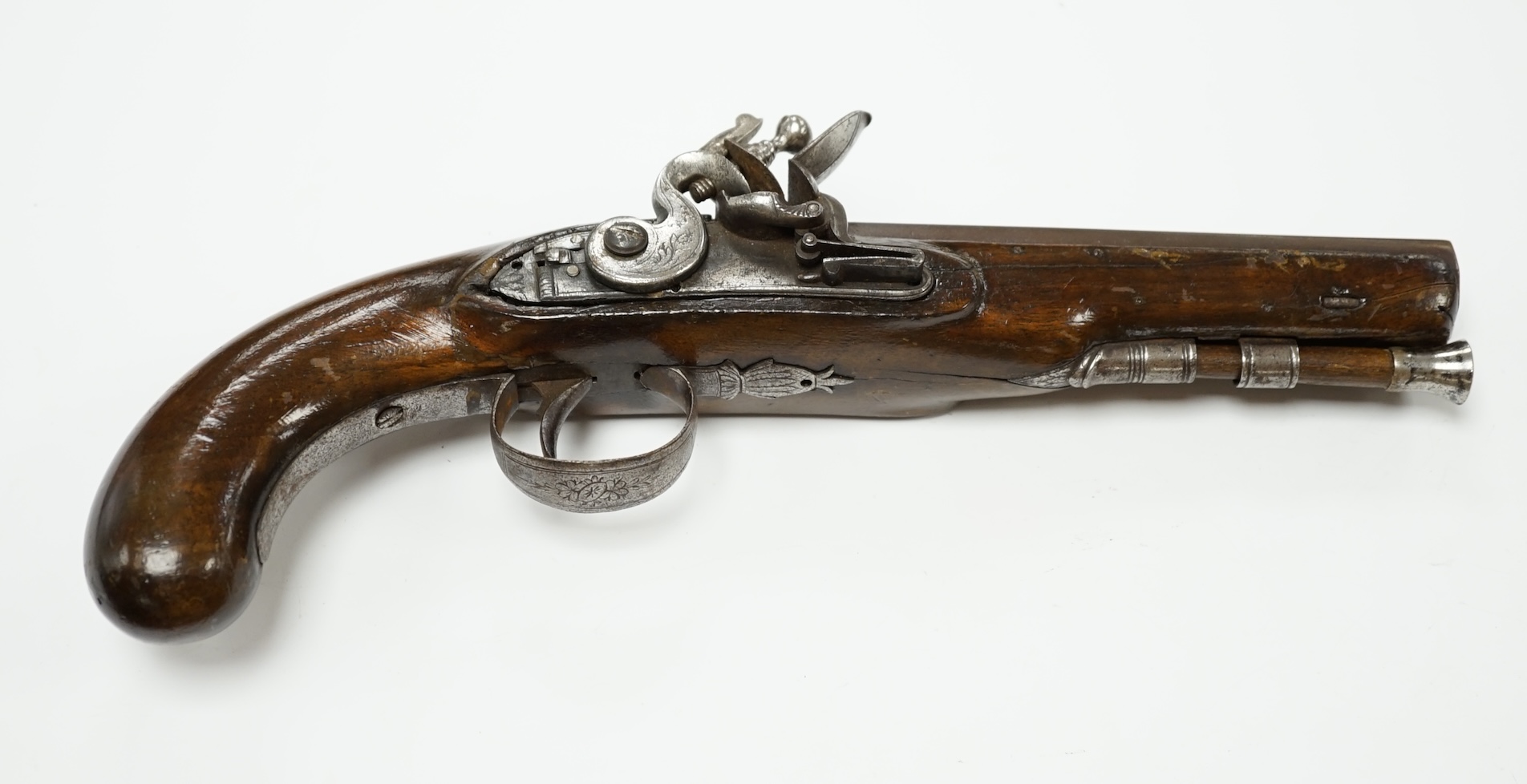 An early 19th century 12 bore fully stocked flintlock holster pistol, octagonal barrel with Birmingham proof marks, engraved iron trigger guard, iron tipped wooden ramrod, barrel 15.5cm. Condition - fair, cock replaced,